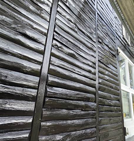Holzfassade vor der Sanierung